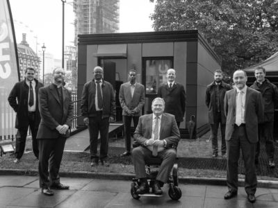 From left to right: Captain John Clifton, The Reverend Anthony Ball, Emmanuel Gotora, Stephen Serrant, Andy Hill, Lieutenant Colonel Drew McCombe, Tom Hill, Eddie Hughes MP, The Reverend Dr James Hawkey