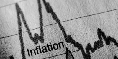 A black and white image of a graph that shows the rise and fall of inflation