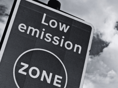 Black and white image of road sign stating low emission zone.