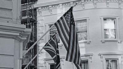 Black and white flag of UK and USA on building