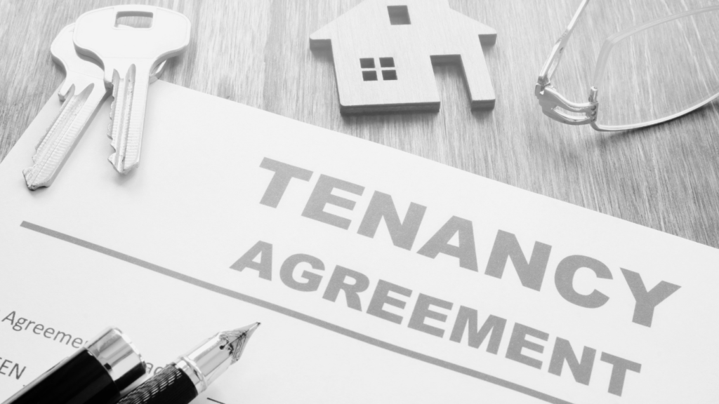 Tenancy Agreement Contract with keys and keyring house in black and white