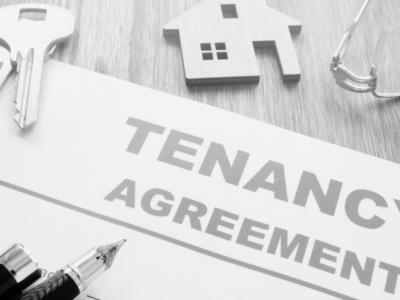 Tenancy Agreement Contract with keys and keyring house in black and white