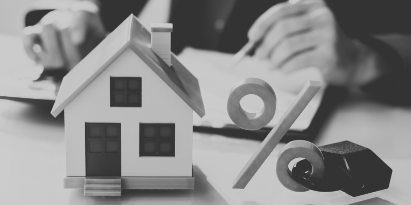 Black and white image with house and percentage symbol with a lock