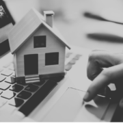 Black and White Model House sitting on top of laptop