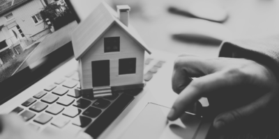 Black and White Model House sitting on top of laptop