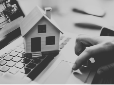 Black and White Model House sitting on top of laptop