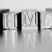 Black and white metal blocks with HMO letters