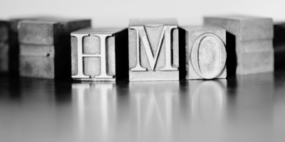 Black and white metal blocks with HMO letters