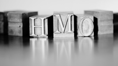 Black and white metal blocks with HMO letters