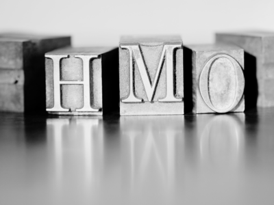 Black and white metal blocks with HMO letters