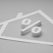 house cut out with percentage sign in black and white