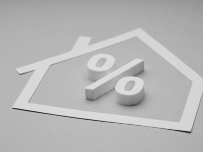 house cut out with percentage sign in black and white