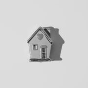 Black and white ceraminc house with heart on the roof