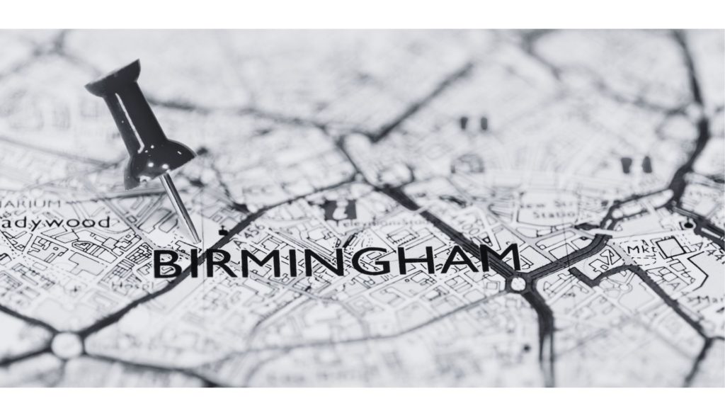 black and white image of map with text Birmingham and pin in the map