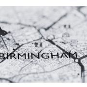 black and white image of map with text Birmingham and pin in the map