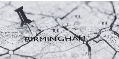 black and white image of map with text Birmingham and pin in the map