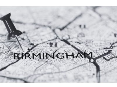 black and white image of map with text Birmingham and pin in the map