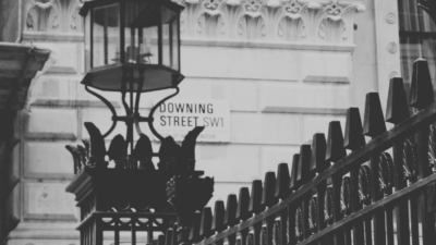 Black and white picture of Downign Street sign