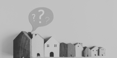 Line of houses with question mark