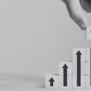Upward arrows with building blocks pointing up