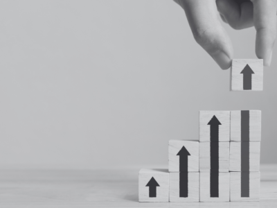 Upward arrows with building blocks pointing up