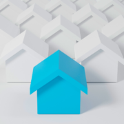 Row of digital houses with blue house leading