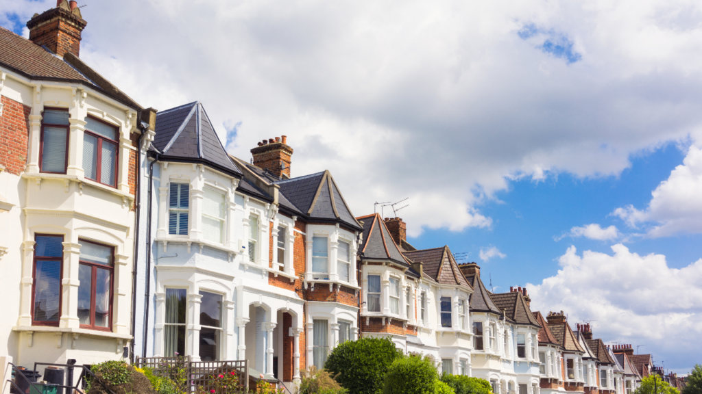 Row of houses and clouds with blue skies at the top
