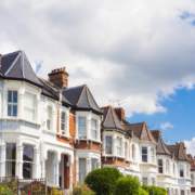 Row of houses and clouds with blue skies at the top