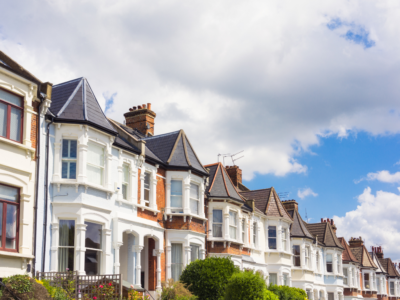 Row of houses and clouds with blue skies at the top