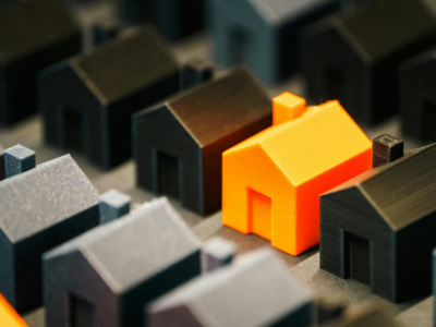 Rows of black houses and orange house