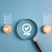 Document outlines with a magnifying glass on a badge with blue background