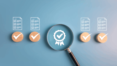 Document outlines with a magnifying glass on a badge with blue background