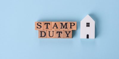 Image of text with wooden letters stating stamp duty