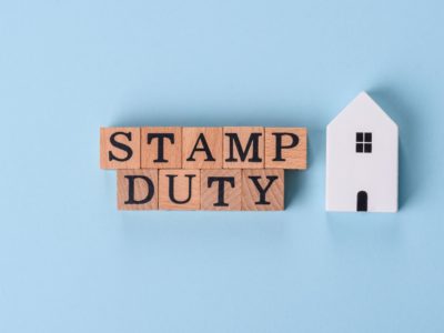 Image of text with wooden letters stating stamp duty