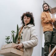 Two people moving with boxes