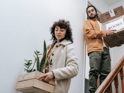 Two people moving with boxes