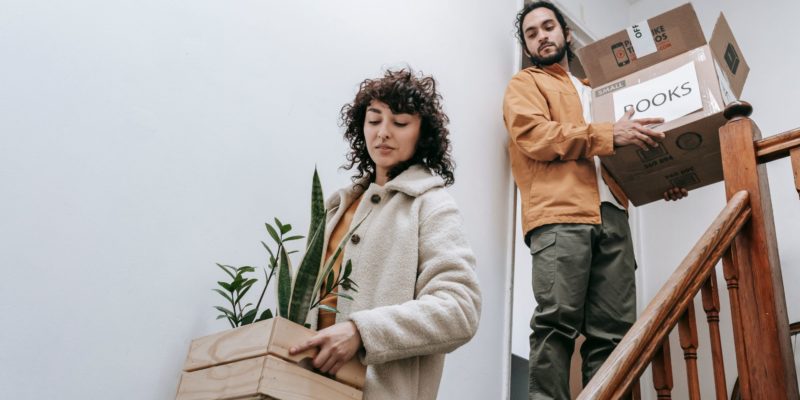 Two people moving with boxes