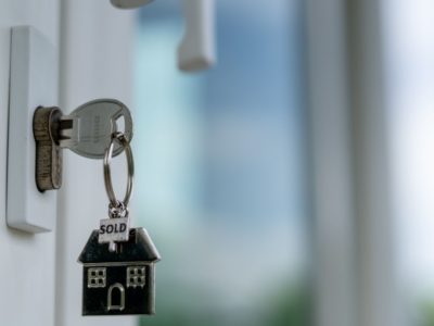 Key in the door with a house keyring
